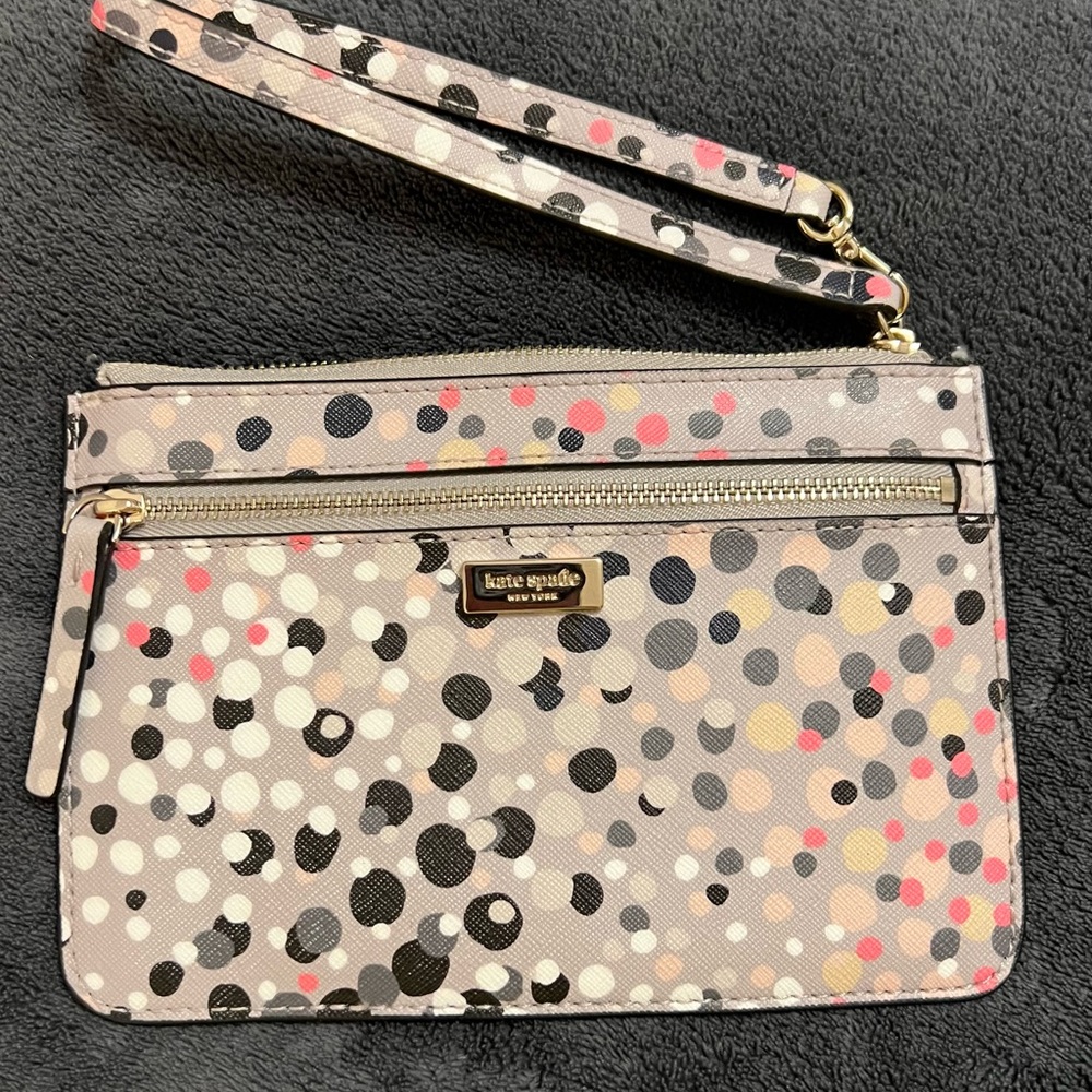 Brand New grey polka dotted Kate Spade wristlet.